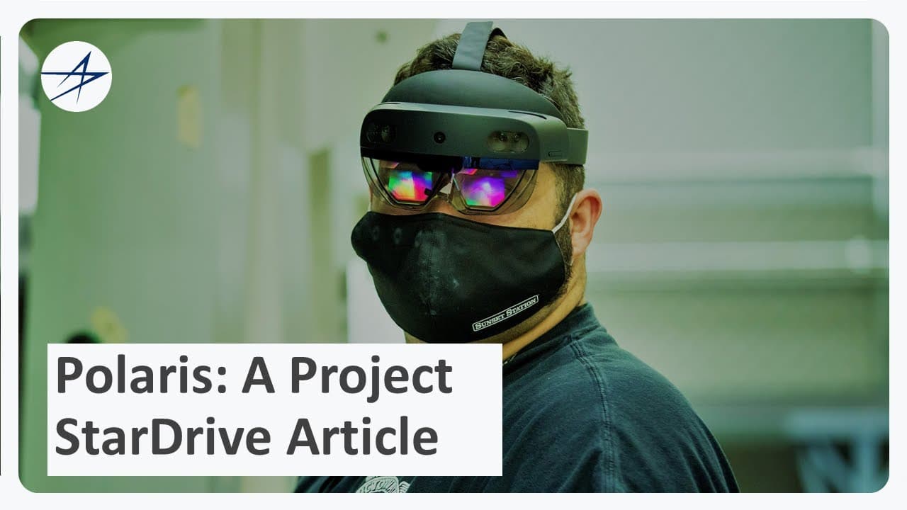 A Lockheed Martin manufacturing engineer wearing a HoloLens 2 running VisAR on the factory floor